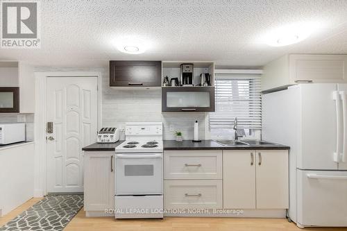 38 Laidlaw St, Wasaga Beach, ON - Indoor Photo Showing Kitchen With Double Sink