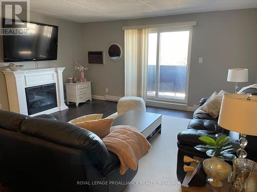 #202 -795 Sherbrooke St, Peterborough, ON - Indoor Photo Showing Living Room With Fireplace