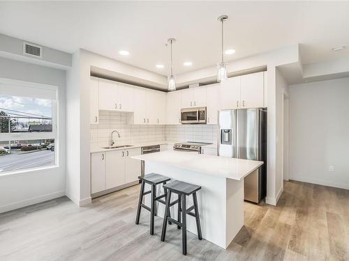 207-140 Jensen Ave West, Parksville, BC - Indoor Photo Showing Kitchen With Upgraded Kitchen