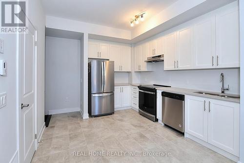 L105 - 9560 Islington Avenue, Vaughan, ON - Indoor Photo Showing Kitchen With Double Sink