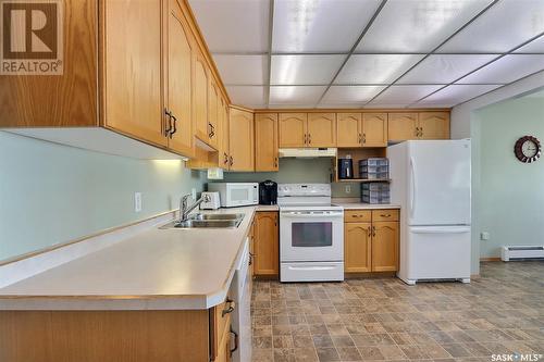 312 305 34Th Street W, Prince Albert, SK - Indoor Photo Showing Kitchen With Double Sink