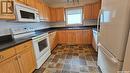 355 165 Robert Street W, Swift Current, SK  - Indoor Photo Showing Kitchen With Double Sink 