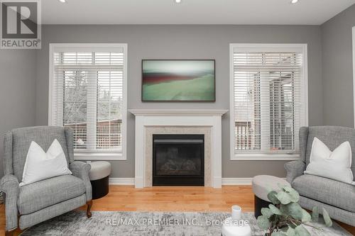 24 Cayton Cres, Bradford West Gwillimbury, ON - Indoor Photo Showing Living Room With Fireplace