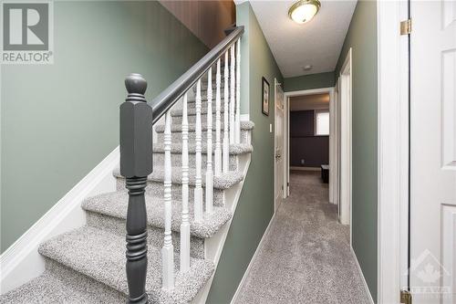 Stairs to lower level with lush carpet (2023) - 171 Briston Private, Ottawa, ON - Indoor Photo Showing Other Room