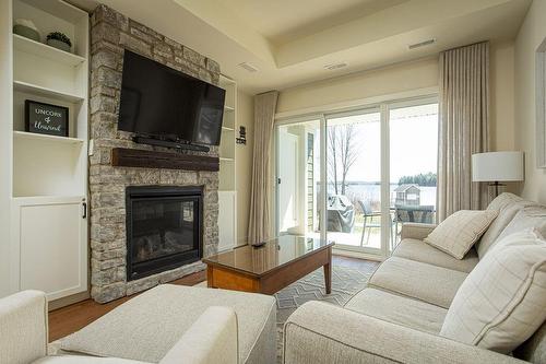 1869 Highway 118 West Road|Unit #A105, Bracebridge, ON - Indoor Photo Showing Living Room With Fireplace