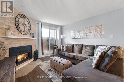 #120 -725 Deveron Cres, London, ON - Indoor Photo Showing Living Room With Fireplace