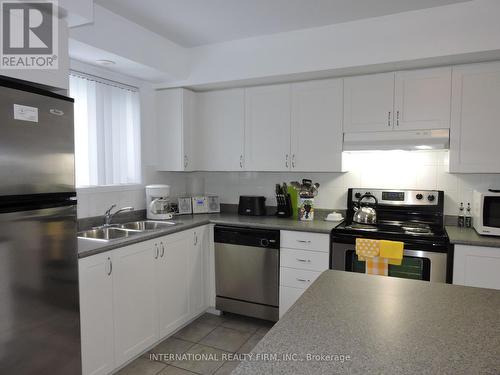 24 - 5035 Oscar Peterson Boulevard, Mississauga, ON - Indoor Photo Showing Kitchen With Double Sink