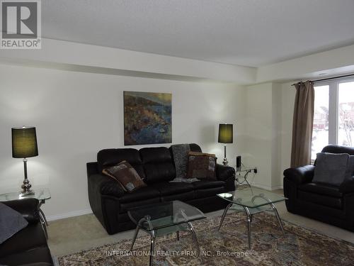 24 - 5035 Oscar Peterson Boulevard, Mississauga, ON - Indoor Photo Showing Living Room