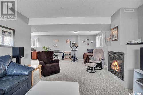 131 Main Street W, Warman, SK - Indoor Photo Showing Living Room With Fireplace