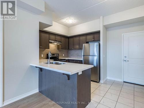#408 -650 Sauve St, Milton, ON - Indoor Photo Showing Kitchen With Stainless Steel Kitchen With Double Sink