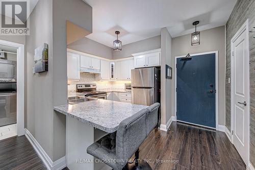 #208 -720 Yonge St, Barrie, ON - Indoor Photo Showing Kitchen With Double Sink