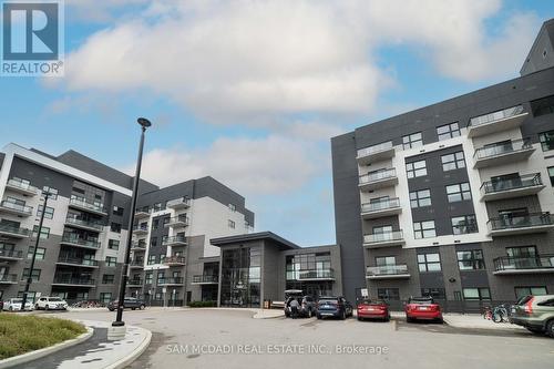 #216 -102 Grovewood Common Cres, Oakville, ON - Outdoor With Balcony With Facade