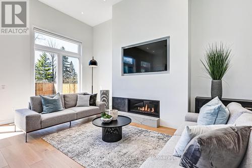 8705 Beachwood Road, Wasaga Beach, ON - Indoor Photo Showing Living Room With Fireplace