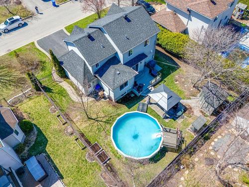 Backyard - 117 Rue Lucien-Thériault, Notre-Dame-De-L'Île-Perrot, QC - Outdoor With Above Ground Pool
