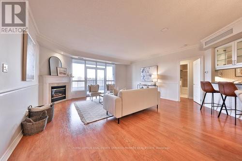 #607 -1900 The Collegeway, Mississauga, ON - Indoor Photo Showing Living Room With Fireplace
