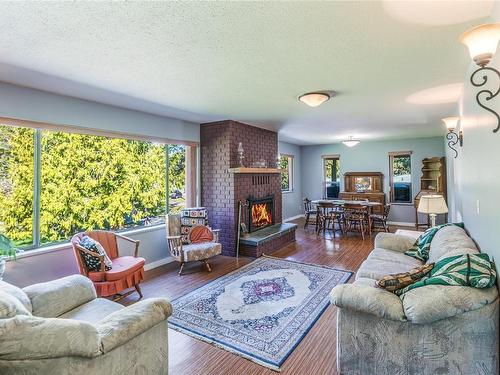 4517 Callow Rd, Bowser, BC - Indoor Photo Showing Living Room With Fireplace