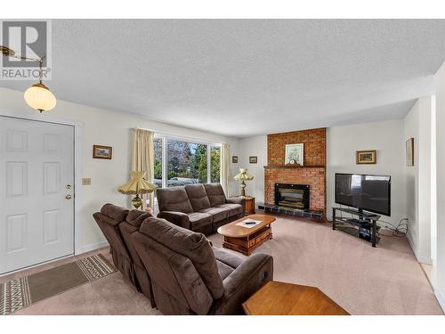 1157 Trevor Drive, West Kelowna, BC - Indoor Photo Showing Living Room With Fireplace