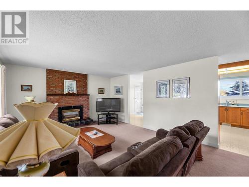 1157 Trevor Drive, West Kelowna, BC - Indoor Photo Showing Living Room With Fireplace