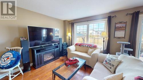 8330 86 Avenue, Fort St. John, BC - Indoor Photo Showing Living Room With Fireplace