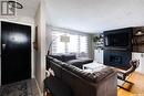 109 Mckee Crescent, Regina, SK  - Indoor Photo Showing Living Room With Fireplace 