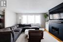109 Mckee Crescent, Regina, SK  - Indoor Photo Showing Living Room With Fireplace 