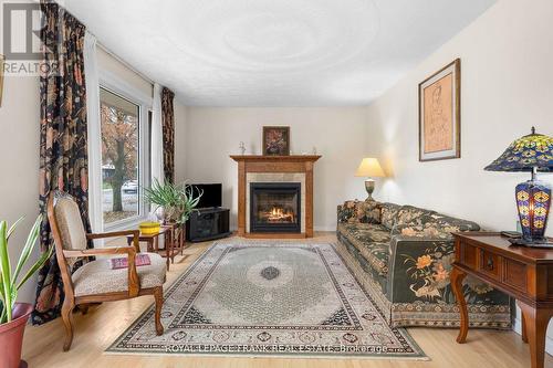 100 Colborne St W, Kawartha Lakes, ON - Indoor Photo Showing Living Room With Fireplace