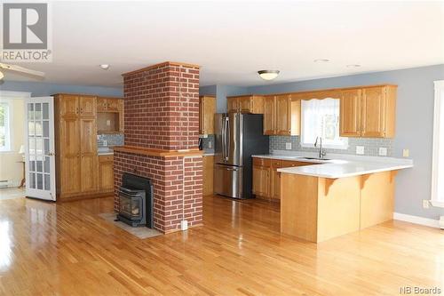 181 Route 636, Harvey, NB - Indoor Photo Showing Kitchen With Fireplace