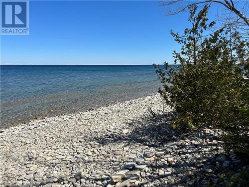 Clean rocky beach - 8 Carter Road, Northern Bruce Peninsula, ON - Outdoor With Body Of Water With View