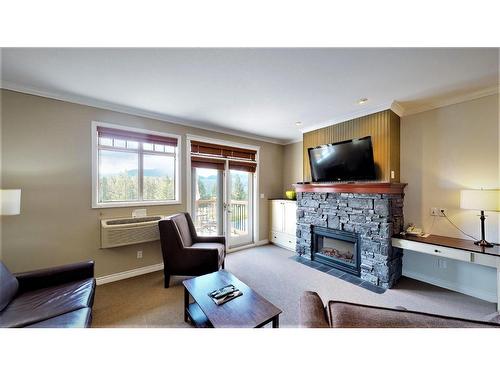 234 A - 200 Bighorn Boulevard, Radium Hot Springs, BC - Indoor Photo Showing Living Room With Fireplace