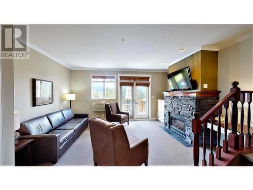 200 Bighorn  Boulevard Unit# 234 A, Radium Hot Springs, BC - Indoor Photo Showing Living Room With Fireplace