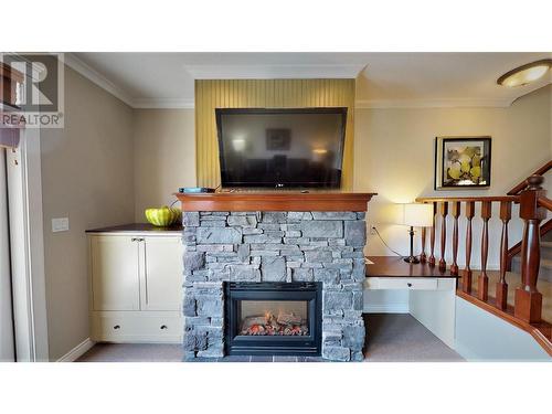 200 Bighorn  Boulevard Unit# 234 A, Radium Hot Springs, BC - Indoor Photo Showing Living Room With Fireplace