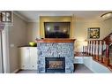 200 Bighorn  Boulevard Unit# 234 A, Radium Hot Springs, BC  - Indoor Photo Showing Living Room With Fireplace 