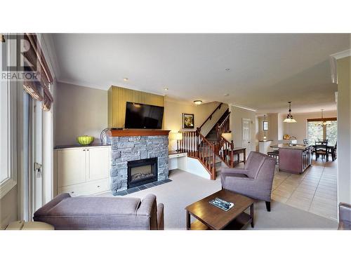 200 Bighorn  Boulevard Unit# 234 A, Radium Hot Springs, BC - Indoor Photo Showing Living Room With Fireplace