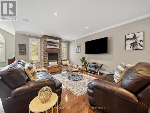 121 Mennill Dr, Springwater, ON - Indoor Photo Showing Living Room With Fireplace