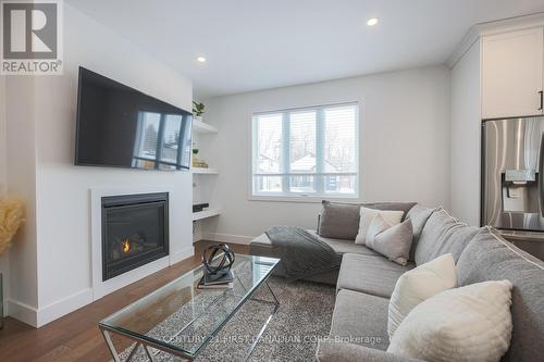 51 - 22701 Adelaide Road, Strathroy-Caradoc, ON - Indoor Photo Showing Living Room With Fireplace