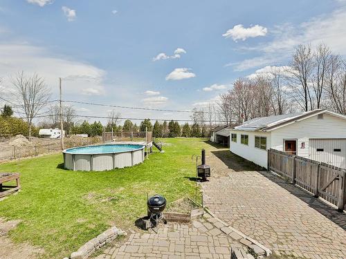 Cour - 69 Rue Bertrand, Saint-Lin/Laurentides, QC - Outdoor With Above Ground Pool With Backyard