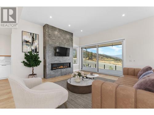 5555 Mountainside Drive, Kelowna, BC - Indoor Photo Showing Living Room With Fireplace
