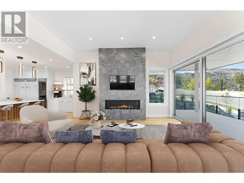 5555 Mountainside Drive, Kelowna, BC - Indoor Photo Showing Living Room With Fireplace