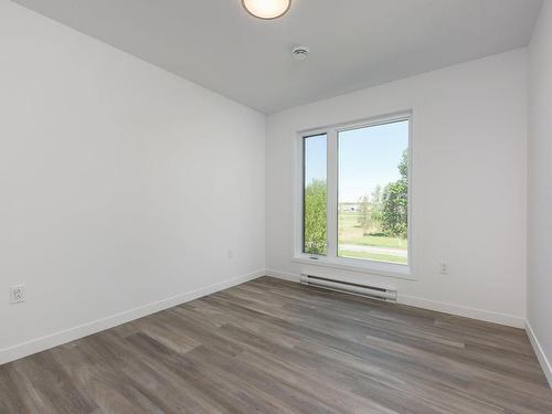 Vue d'ensemble - 406-330 Mtée Du Comté, Les Coteaux, QC - Indoor Photo Showing Other Room