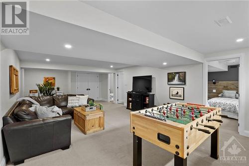 Basement was finished in 2015, potlights and berber carpet. - 10 Okanagan Drive, Ottawa, ON - Indoor Photo Showing Other Room