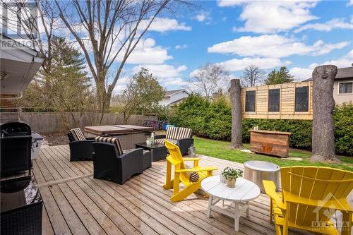 100' wide backyard with a cedar deck, hot tub. - 10 Okanagan Drive, Ottawa, ON - Outdoor With Deck Patio Veranda