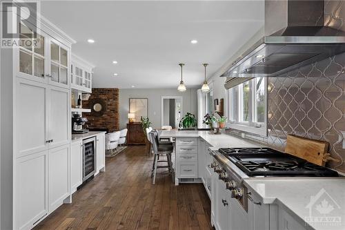 Abundance of cupboards, beautiful quartz countertops, stylish backsplash. - 10 Okanagan Drive, Ottawa, ON - Indoor Photo Showing Kitchen With Upgraded Kitchen