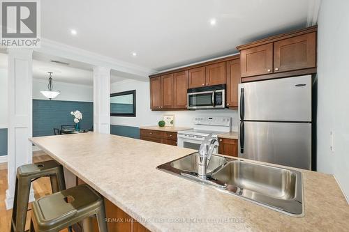 #104 -323 George St, Cobourg, ON - Indoor Photo Showing Kitchen With Double Sink