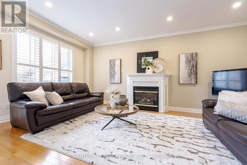 47 Waterbridge Way, Toronto, ON - Indoor Photo Showing Living Room With Fireplace