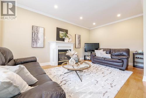 47 Waterbridge Way, Toronto, ON - Indoor Photo Showing Living Room With Fireplace