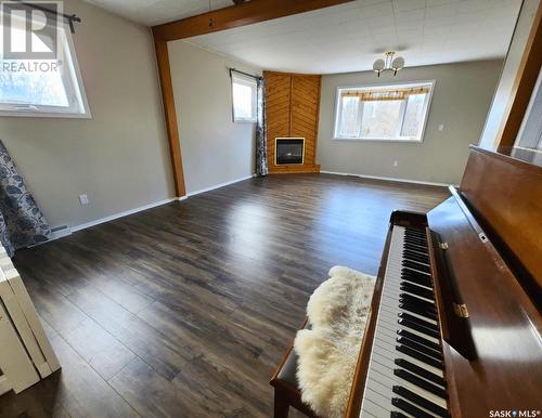 204 King Street, Spy Hill, SK - Indoor Photo Showing Living Room With Fireplace