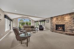 Gas fireplace and wet bar make it a cozy spot to entertain - 