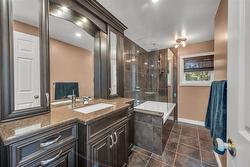 Luxurious main bath with custom cabinets - 