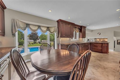 Eating area overlooks pool and yard - 861 Centre Road, Flamborough, ON - Indoor Photo Showing Dining Room