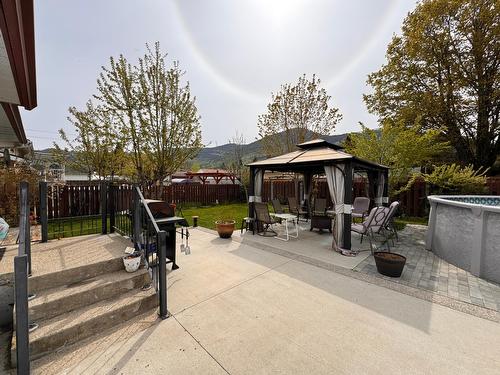 745 10Th Avenue, Montrose, BC - Outdoor With Above Ground Pool With Deck Patio Veranda With Backyard